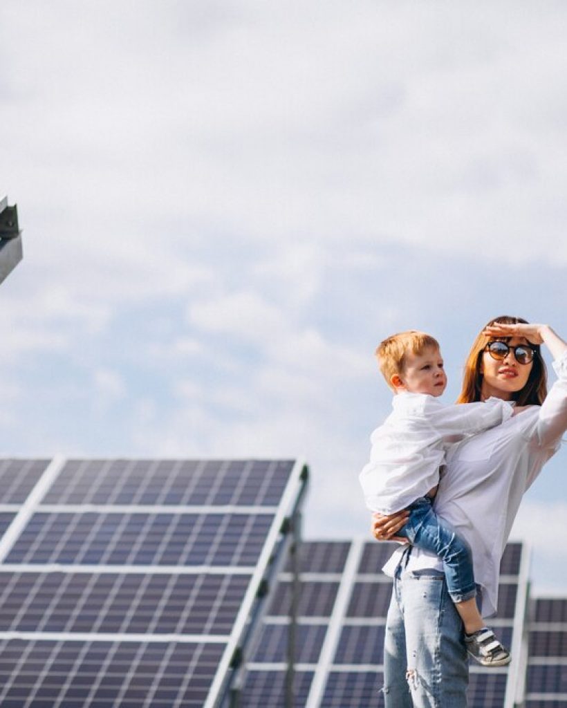 mother-with-her-little-son-by-solar-panels_1303-15544